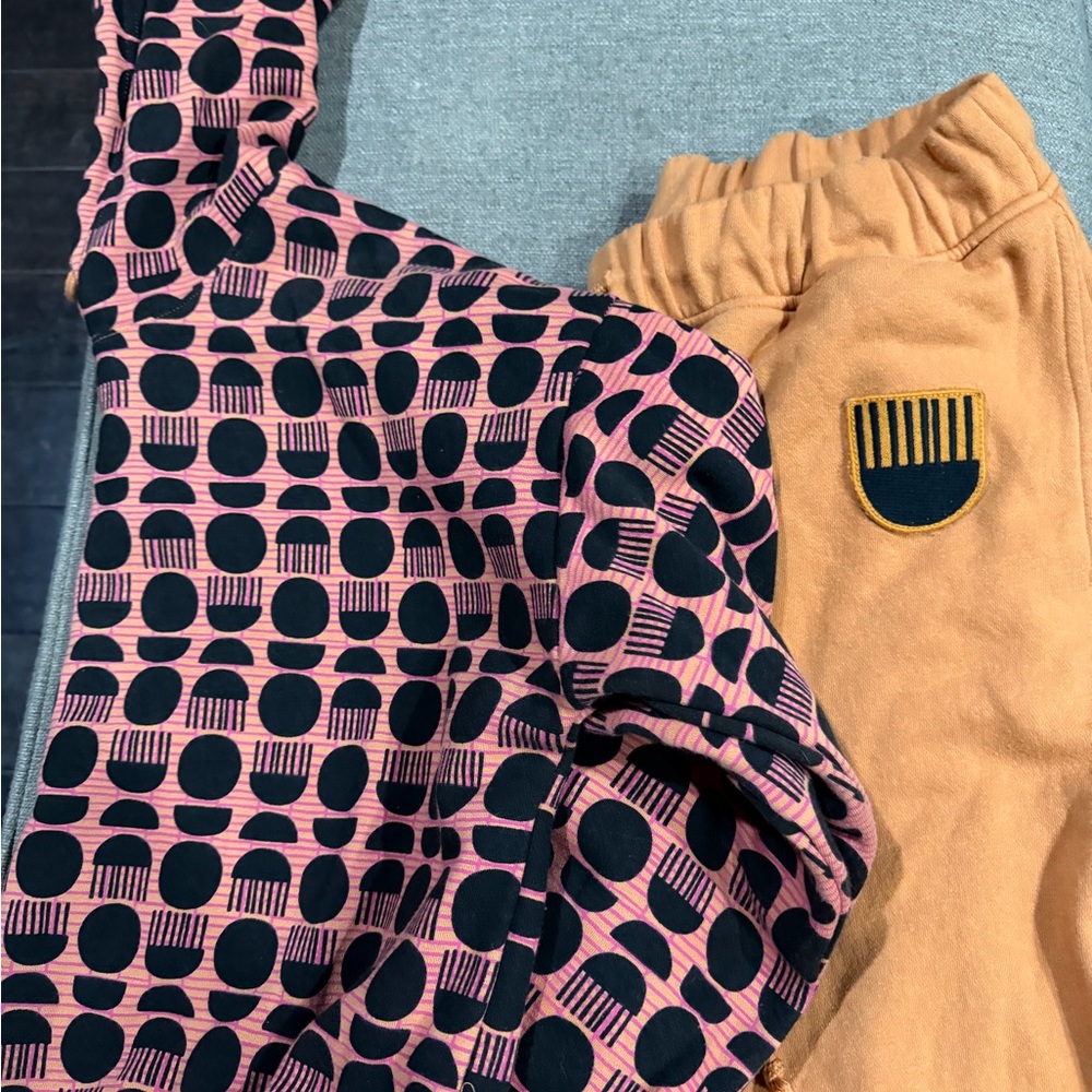 Target Black History Peach, Pink and Black Geometric Top with Tan Pants